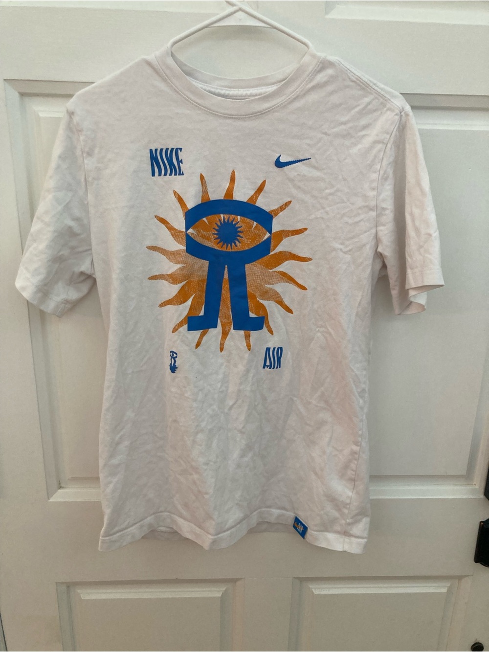 Nike White Short Sleeve T-Shirt with Blue and Gold Sun Graphic
